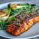 Tender Miso Glazed Salmon with vibrant, crisp sesame bok choy ready to serve.