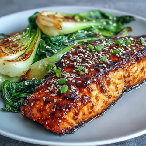 Tender Miso Glazed Salmon with vibrant, crisp sesame bok choy ready to serve.