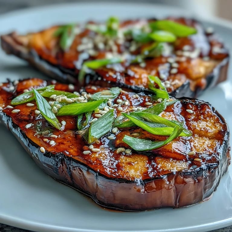 Silky roasted Miso Glazed Eggplant halves, showcasing a rich, umami-packed glaze.