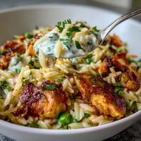 One-Pot Lemon Orzo with Chicken and Peas in a creamy, citrusy sauce with tender chicken and bright green peas.