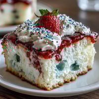 Festive Memorial Day Red White Blue Poke Cake, layered with vibrant swirls.